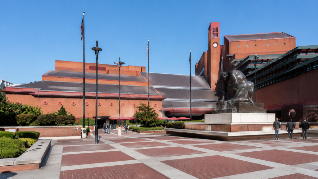 The red-brick forecourt and modern architecture of the British Library in King's Cross, London.